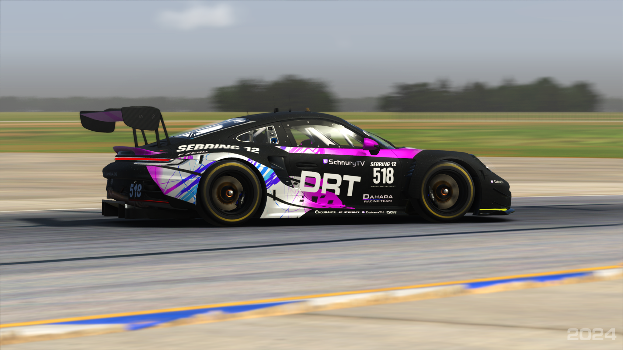 Black and magenta Porsche race car